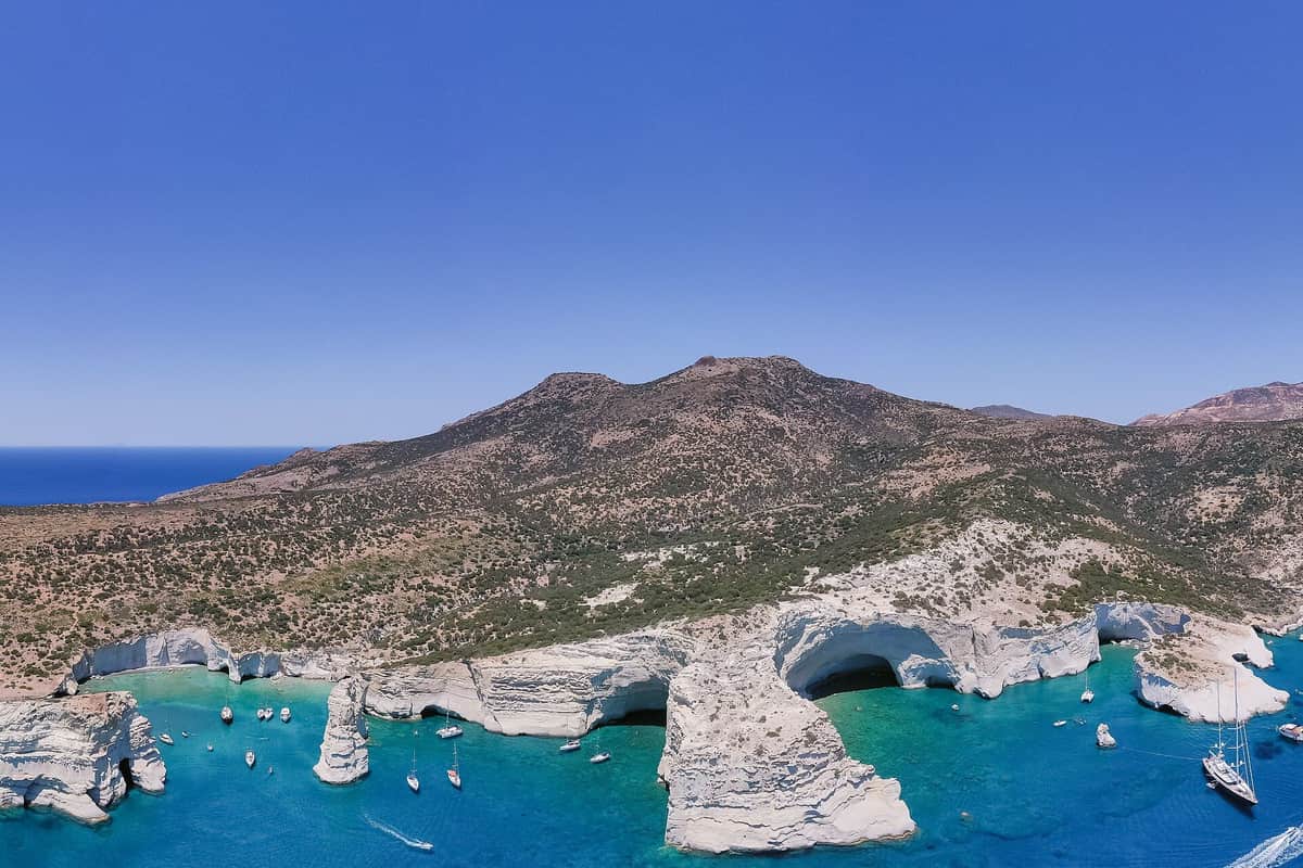 Gerontas beach area: the rock arches of Kleftiko and the empty hills of the west end of Milos