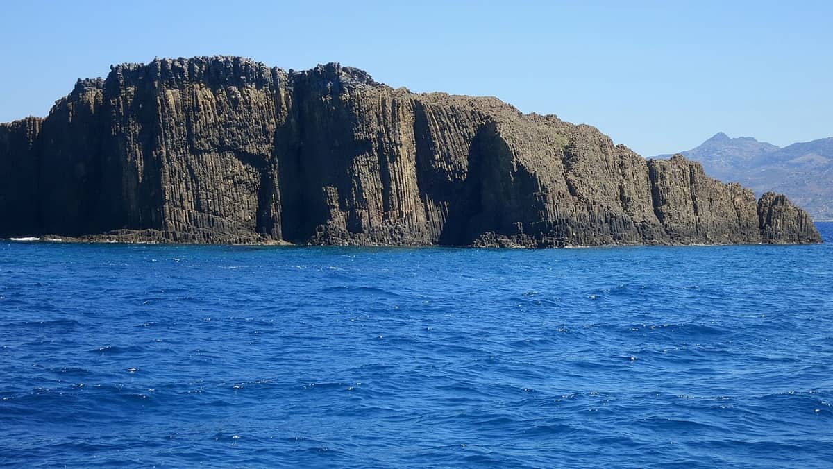 Glaronisia Hotel Milos: the Glaronisia islets off the north coast of Milos, with tall columns of volcanic rock rising from the deep blue sea