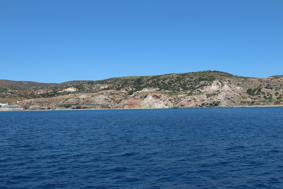 Sweets in Paleochori: the coloured cliffs and the coast of Paleochori on the south of Milos, seen from the deep blue sea
