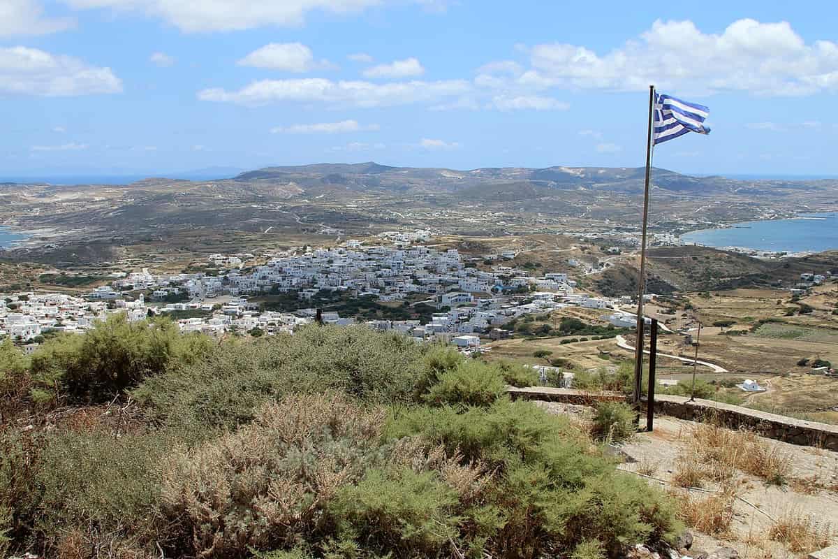 Triovasalos: the white houses of Triovasalos and Pera Triovasalos spread over the hills below the Kastro of Plaka, with the bay of Milos behind